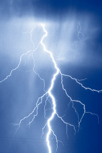 a lightning in front of a dark blue background