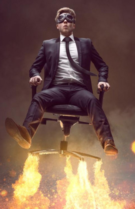 Pic of a MBA graduate flying away on an office chair
